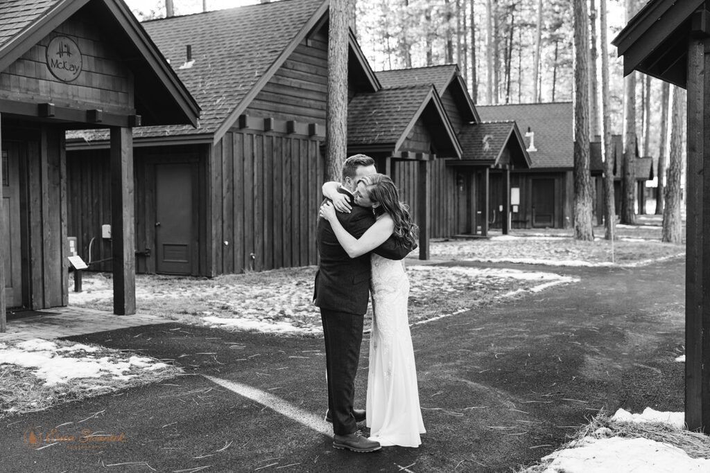 bride and groom hugging during their fivepine lodge wedding day
