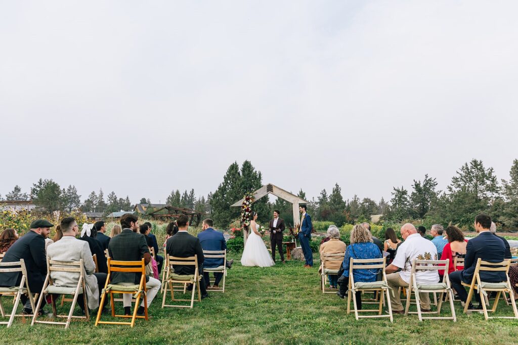 rainshadow organics farm wedding ceremony surrounded by lush flower fields