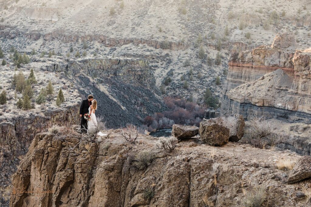 bride and groom hugging during their elopement at oregon high desert