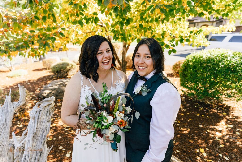 romantic lgbtq couple outdoors during their elopement in bend