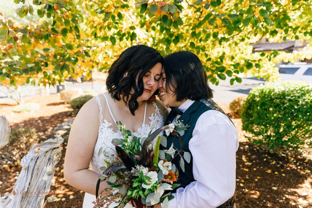 romantic lgbtq couple outdoors during their elopement in bend