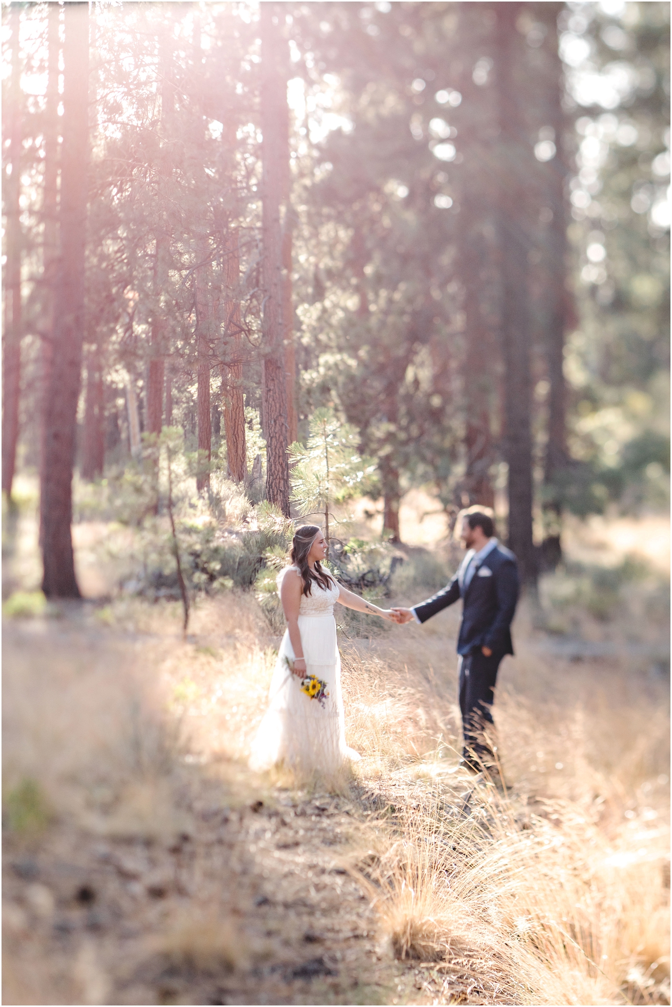 A dreamy artistic wedding photo of the couple standing in the pine forest near the Deschutes River after their Bend Oregon elopement. | Erica Swantek Photography