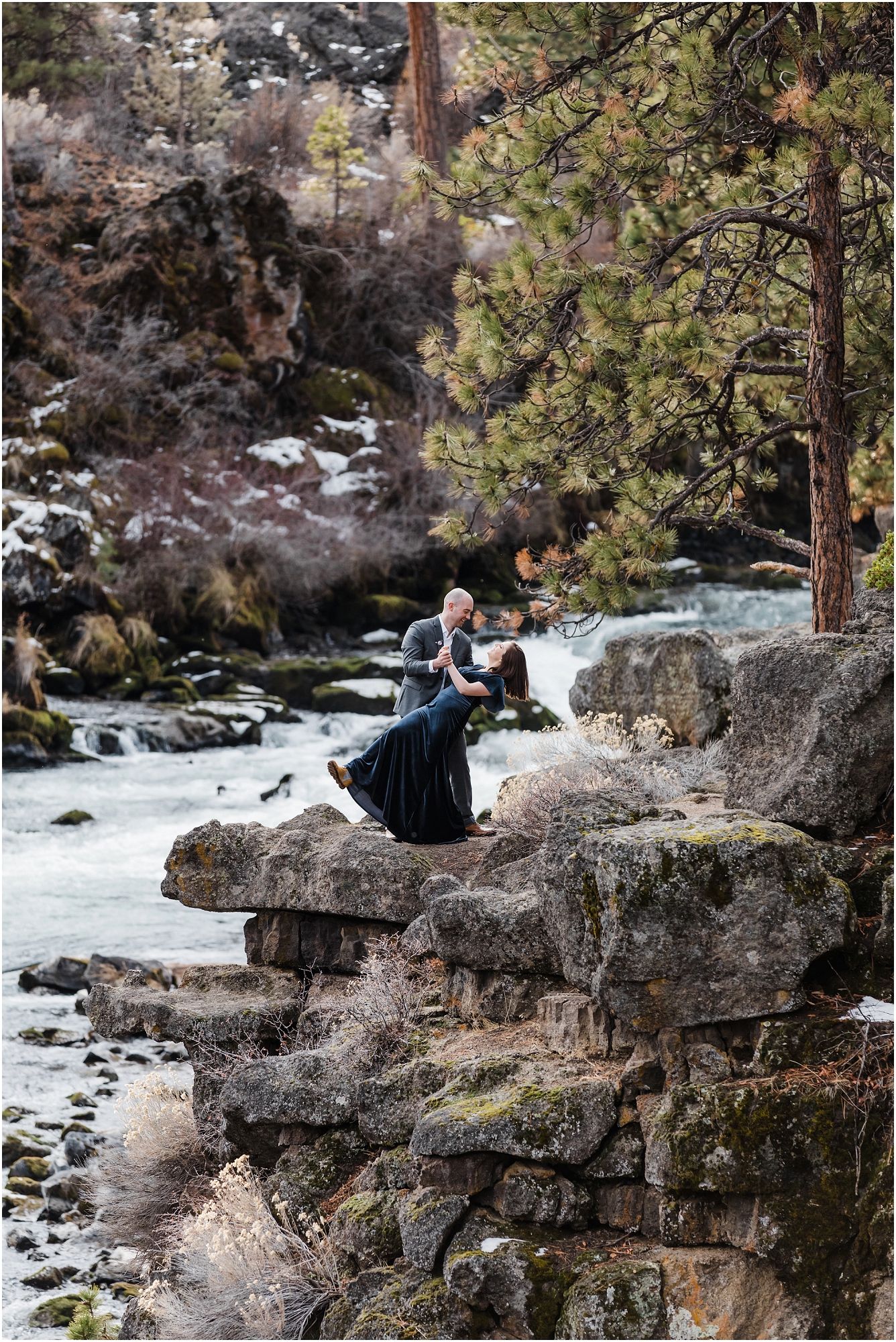 A couple dances along the cliffs above the Deschutes River during their winter elopement in Bend, Oregon. | Erica Swantek Photography
