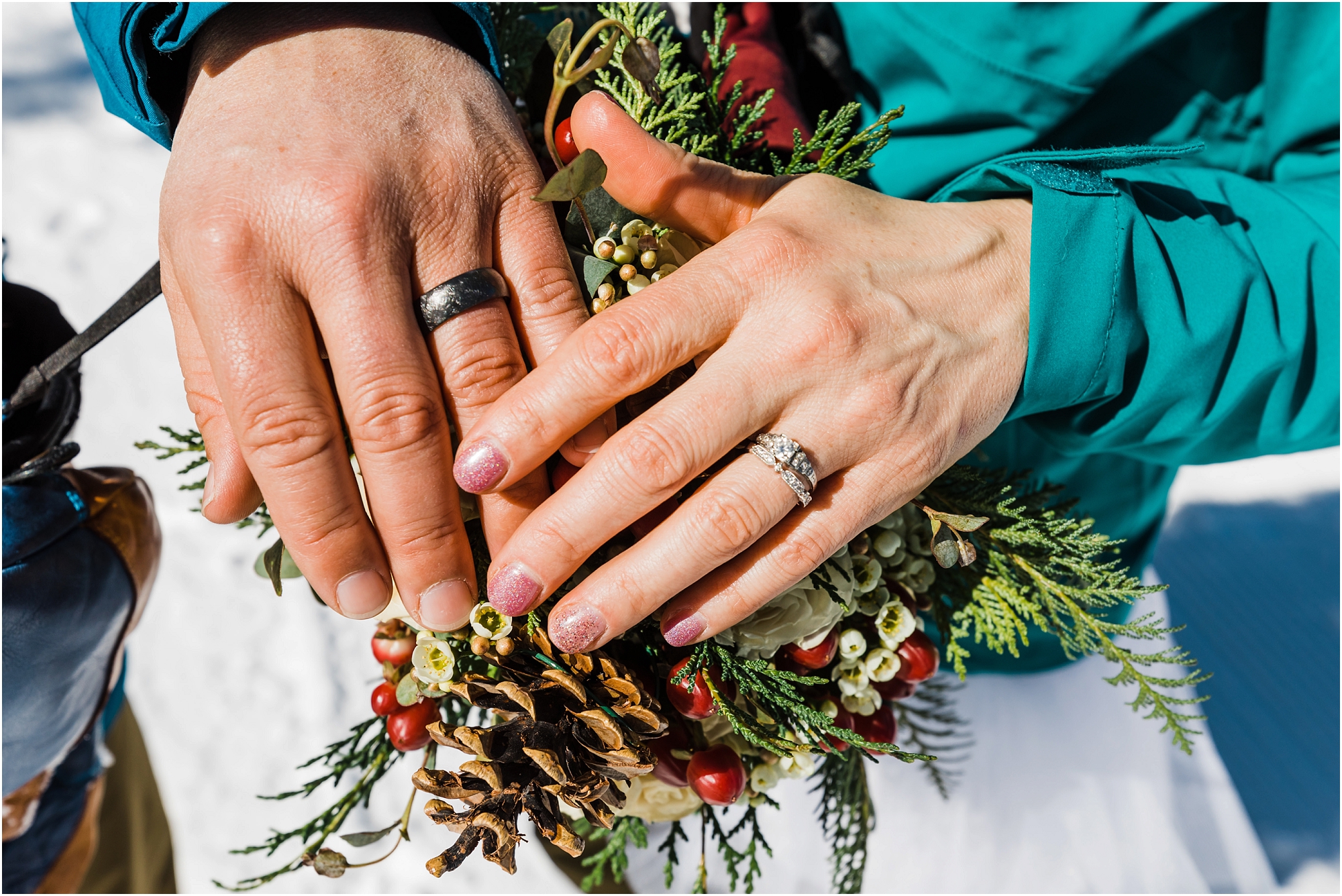 Wedding bands on the ring fingers of a Mt Bachelor winter elopement in Bend, Oregon. | Erica Swantek Photography