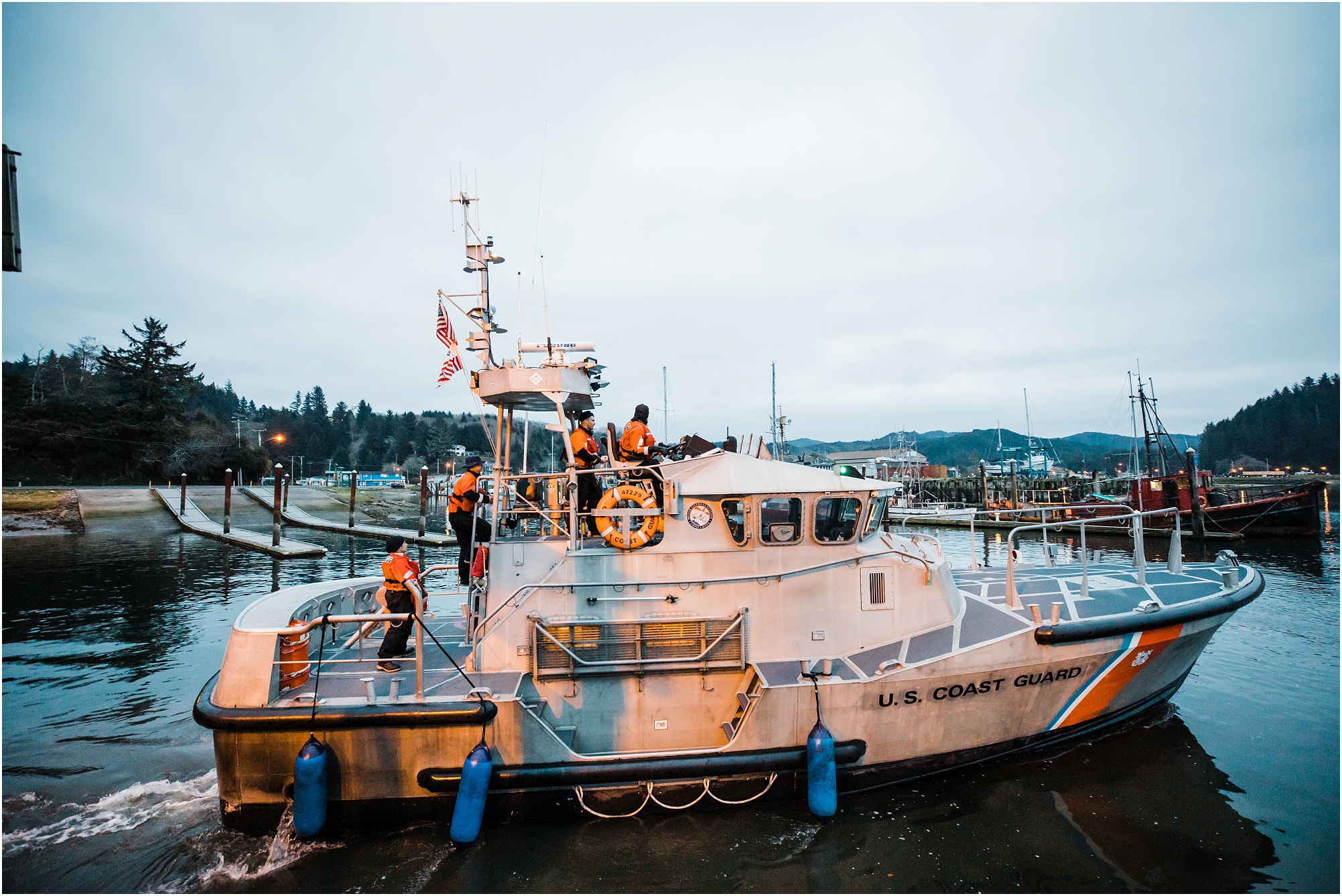 The crew of the US Coast Guard ship serve as witnesses for this Oregon Coast adventure elopement! | Erica Swantek Photography