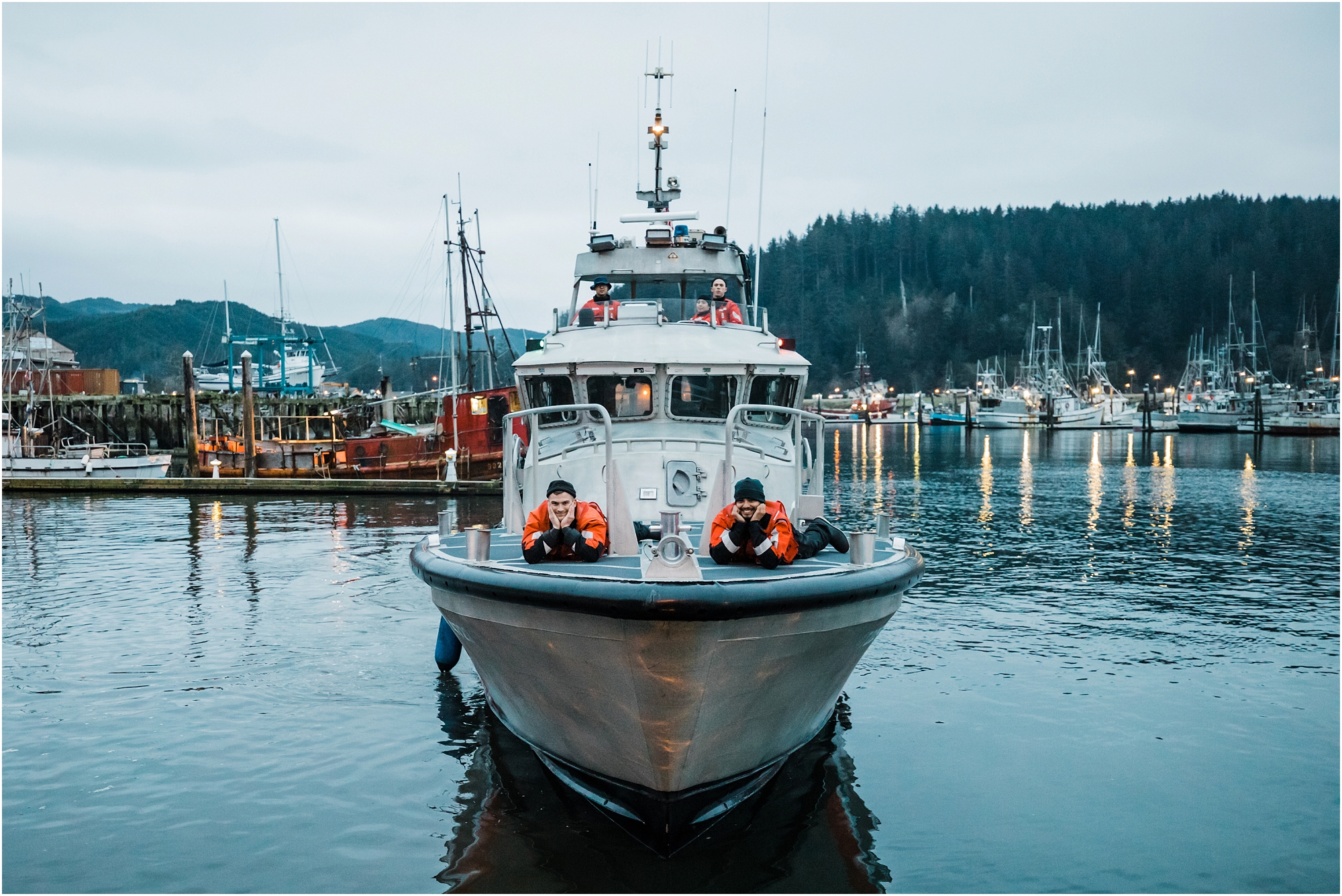 The crew of the US Coast Guard ship serve as witnesses for this Oregon Coast adventure elopement! | Erica Swantek Photography