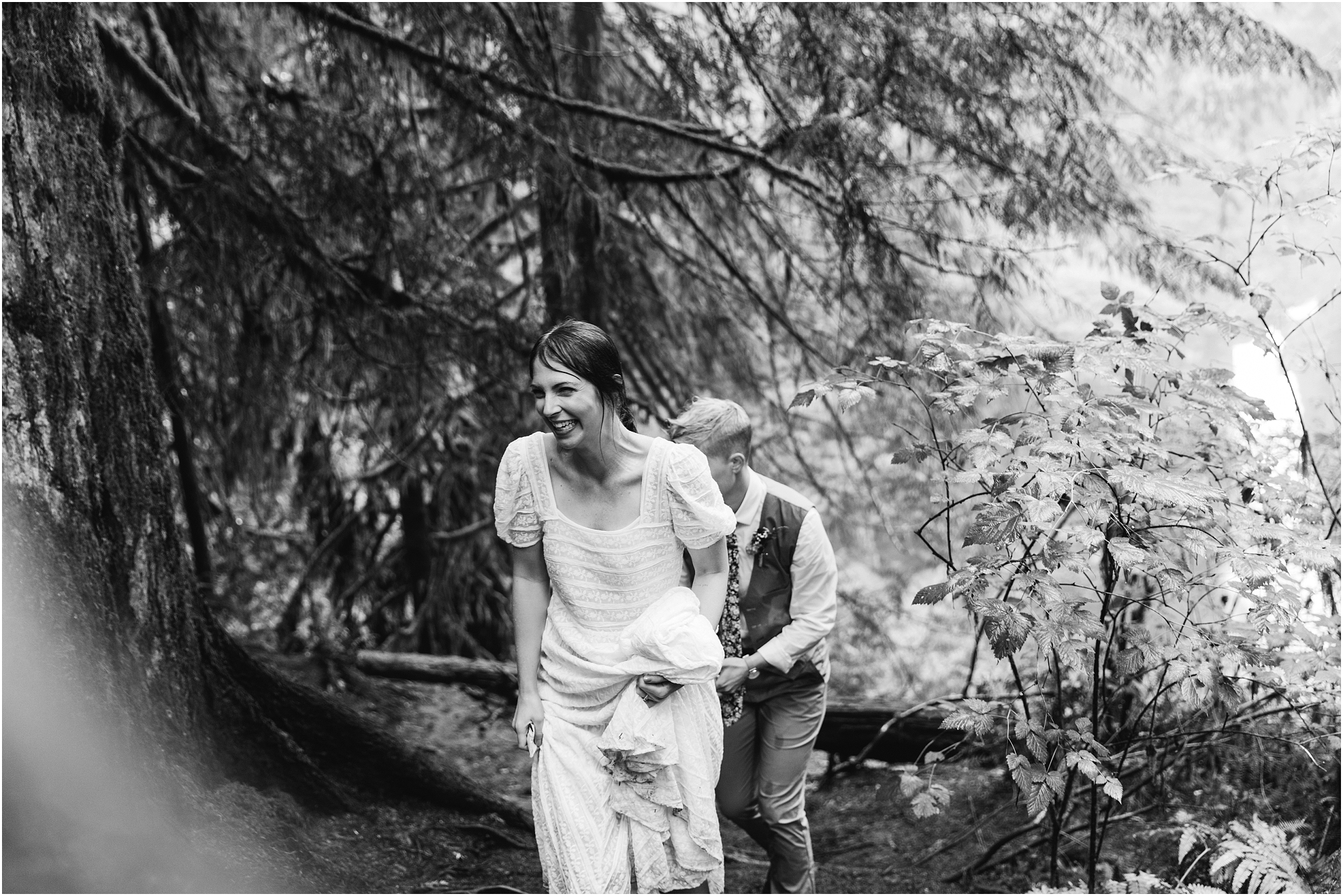 A beautiful black and white image of an LGBTQ+ couple celebrating their union with a unique PNW hiking adventure elopement in Oregon. | Erica Swantek Photography