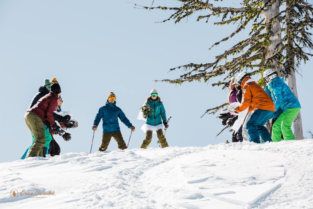 bride and groom skiing down the mountain at mt bachelor