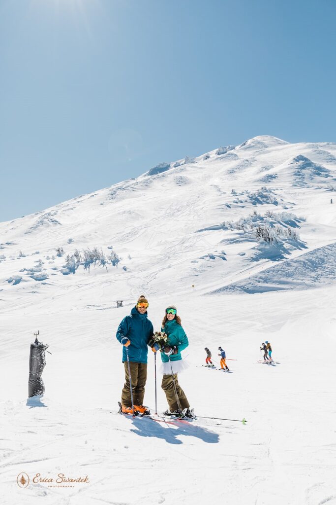 bride and groom posing in their ski gear during their ski elopement a mt bachelor, or