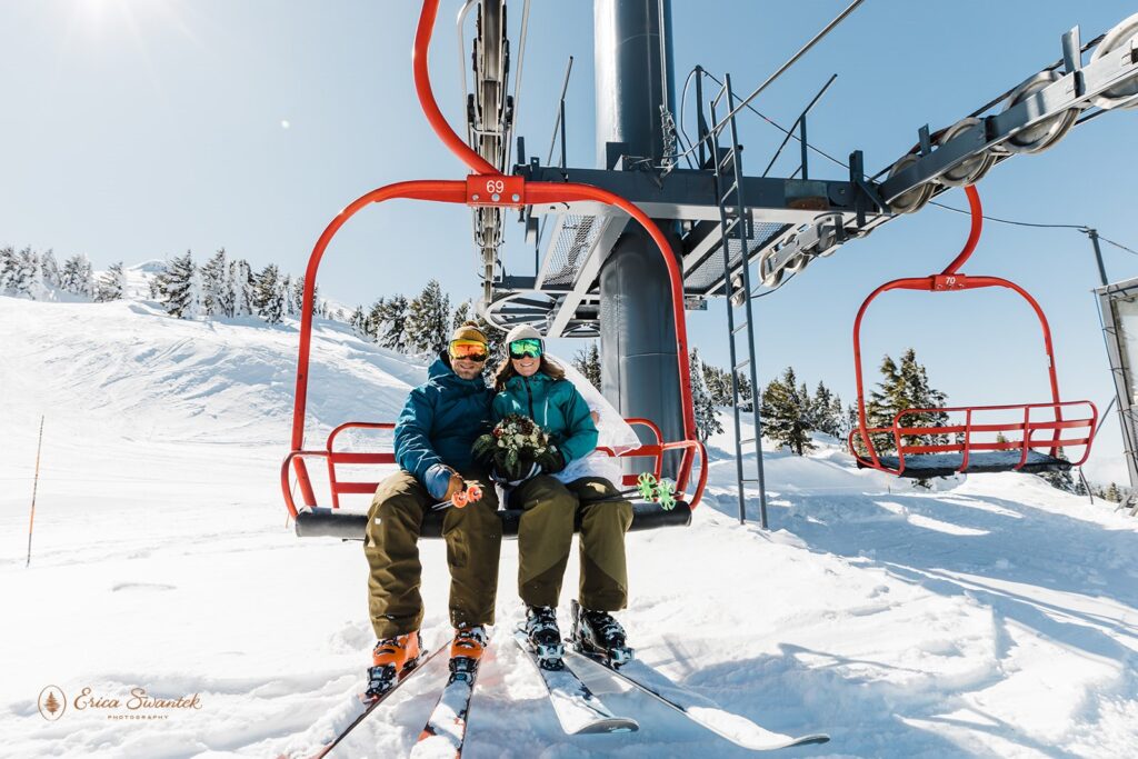 bride and groom on a ski lift 