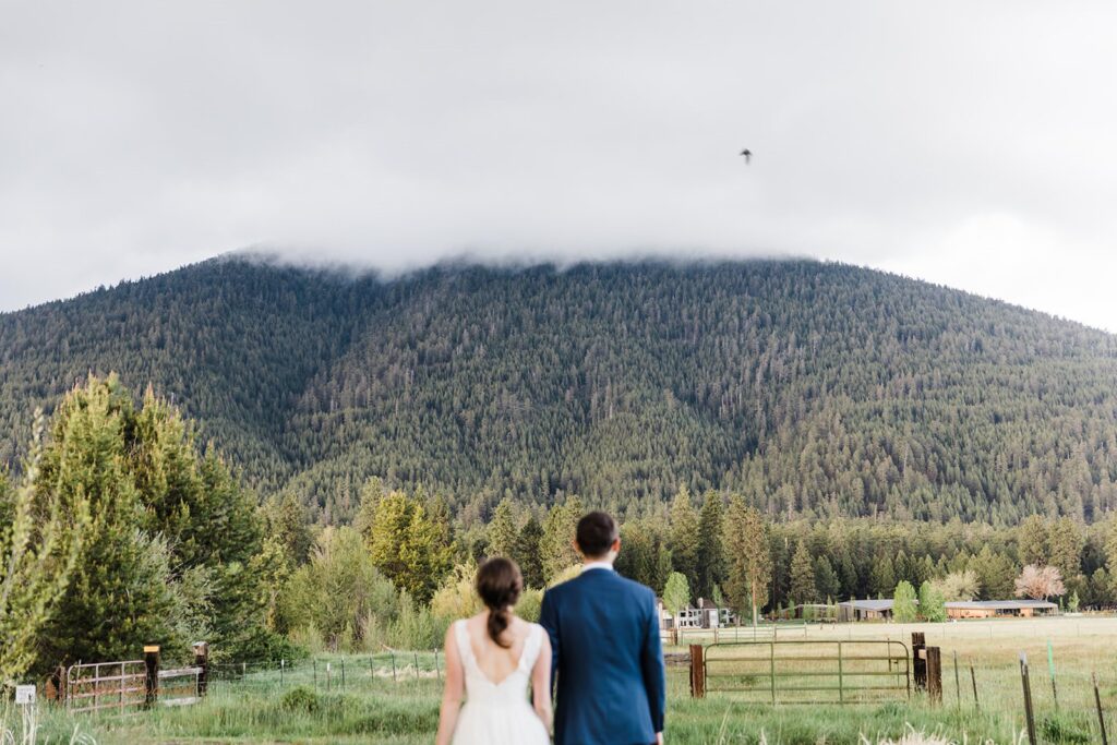 A couple admires a mountain view at a lodge in Oregon.