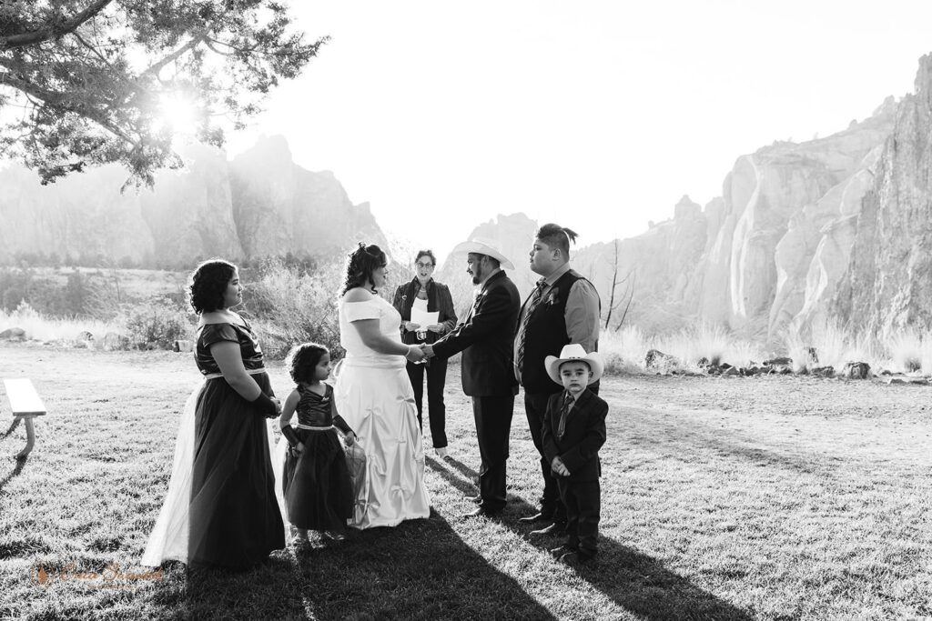 A couple weds underneath a tree in Smith Rock State Park.
