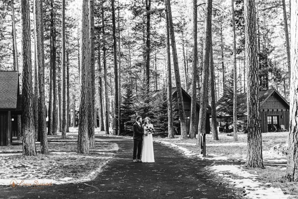 A couple holds hands at FivePines Lodge