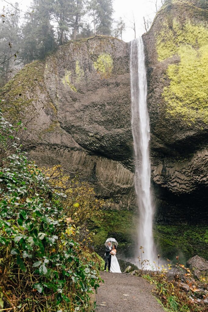 A couple in Oregon weds near a waterfall.