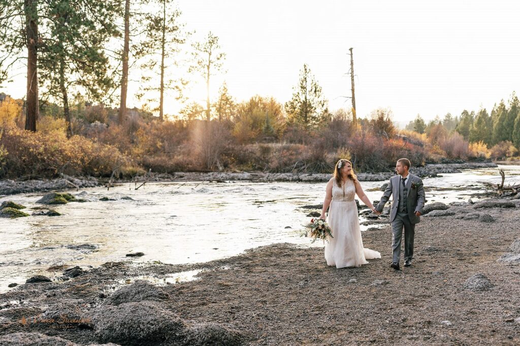 dreamy oregon elopement couple outdoors with fall foliage and water views in the backdrop