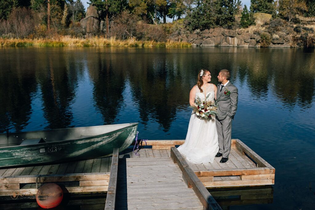 dreamy oregon elopement couple outdoors with fall foliage and water views in the backdrop