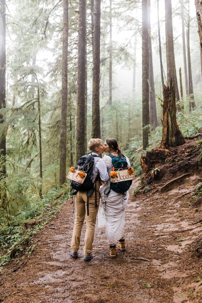 A couple hikes through an Oregon forest on an adventure elopement.
