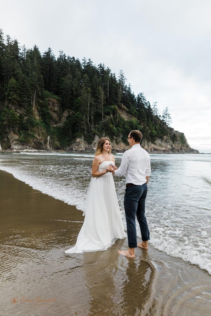 A couple during their vow ceremony on an Oregon beach.