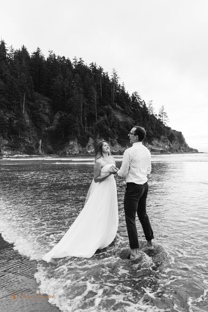 A couple laughs during their Oregon wedding ceremony.