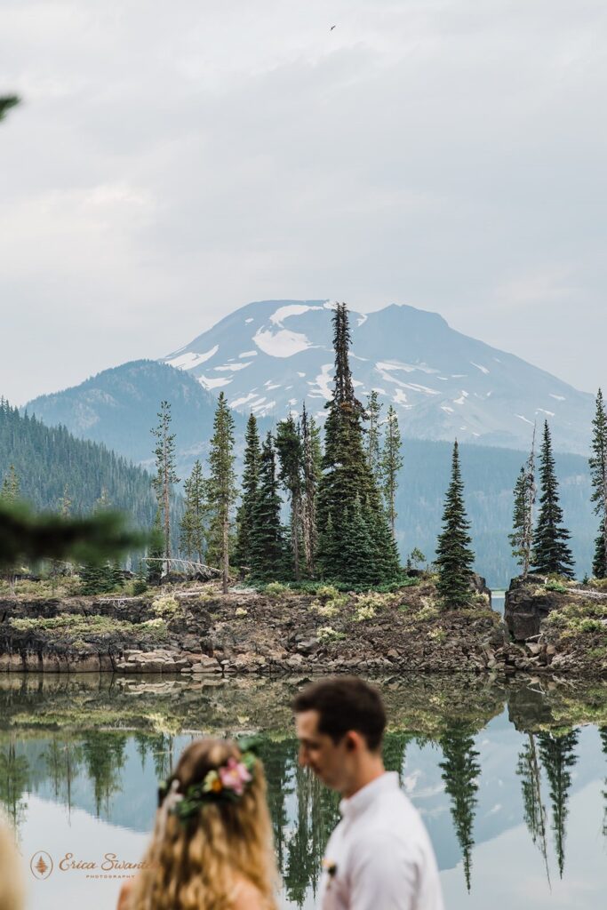 A couple stands near Sparks Lake in Oregon.