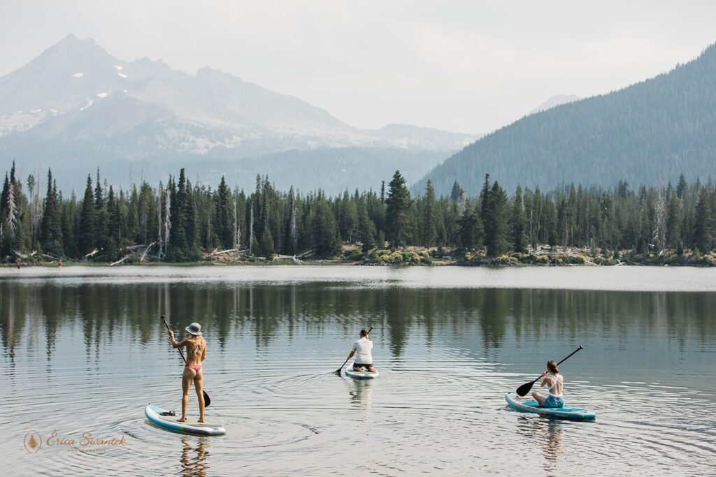 A wedding party kayaks along Sparks Lake in Oregon.