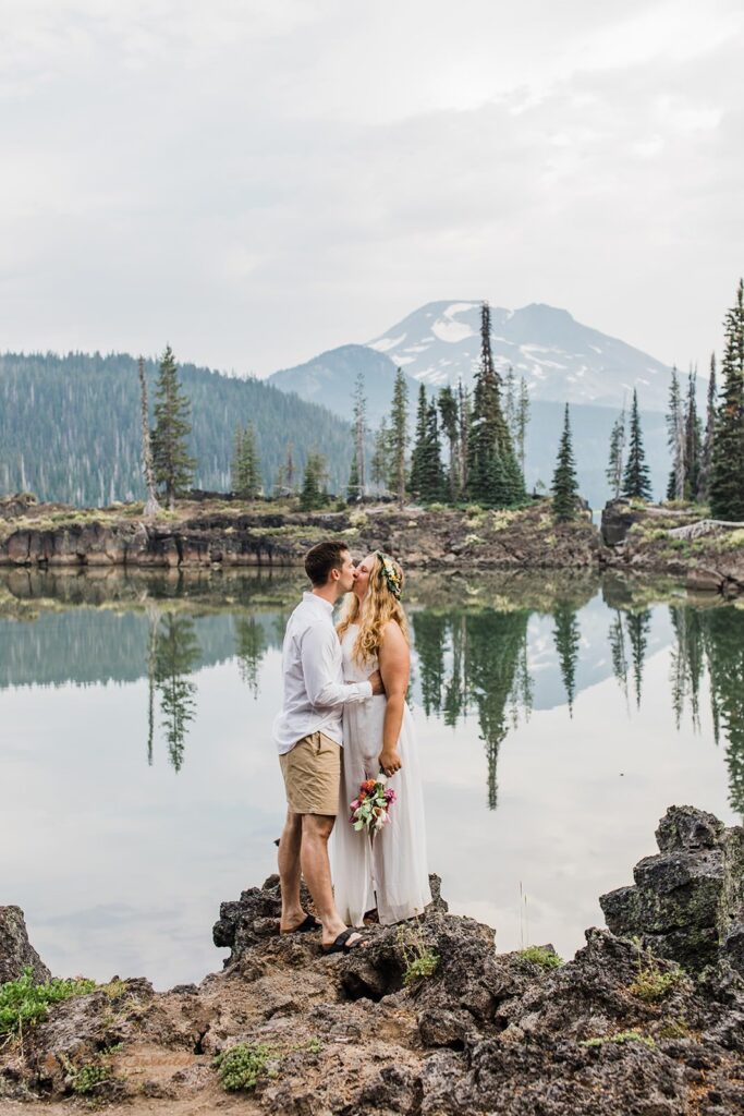 A couple is seen near a lake in Central Oregon during their intimate wedding.