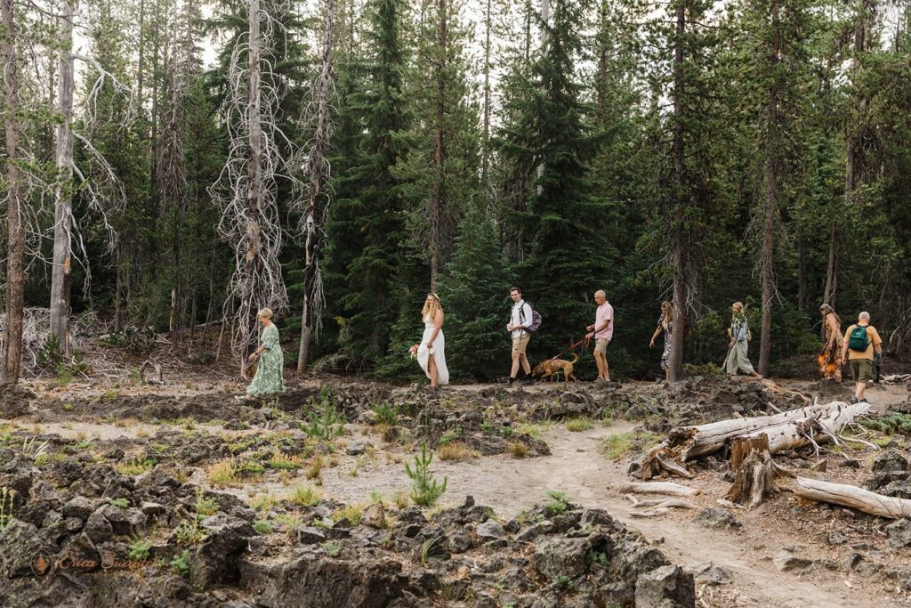 A family hikes to an elopement ceremony in Oregon.