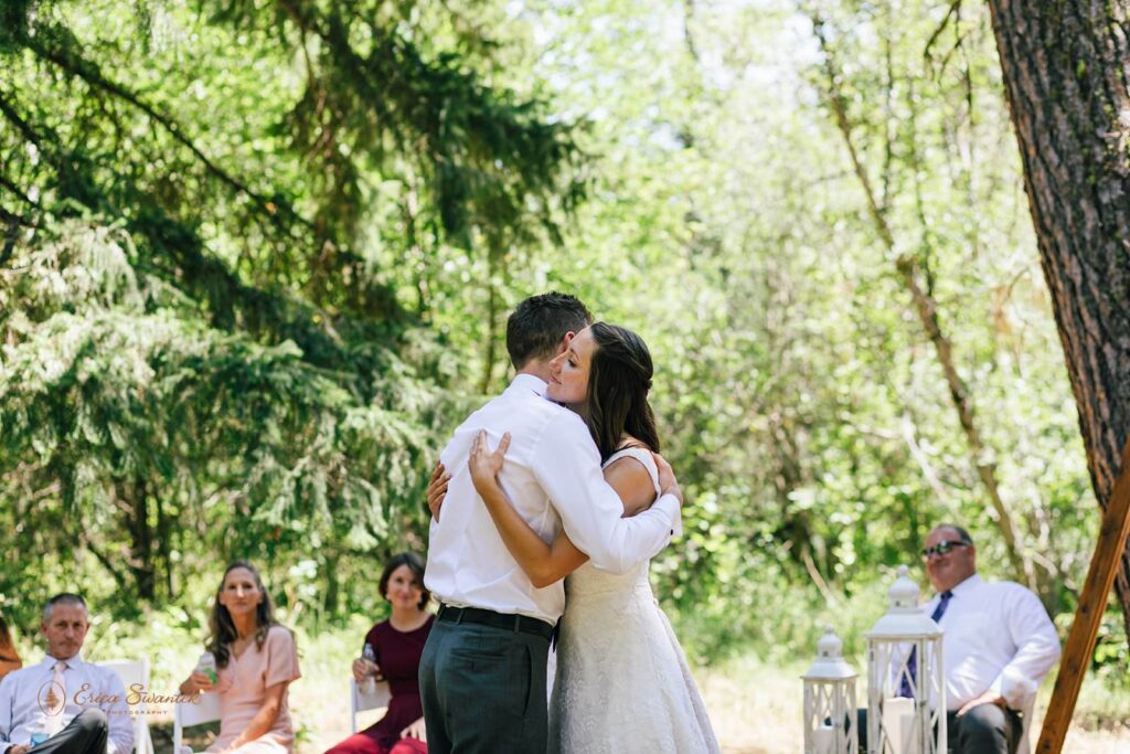 A couple embraces after their first dance during their Washington micro-wedding.