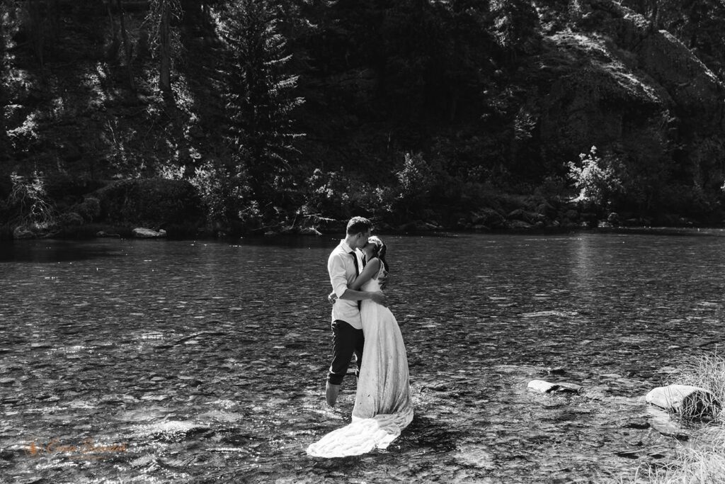 A couple kisses in Naches River.