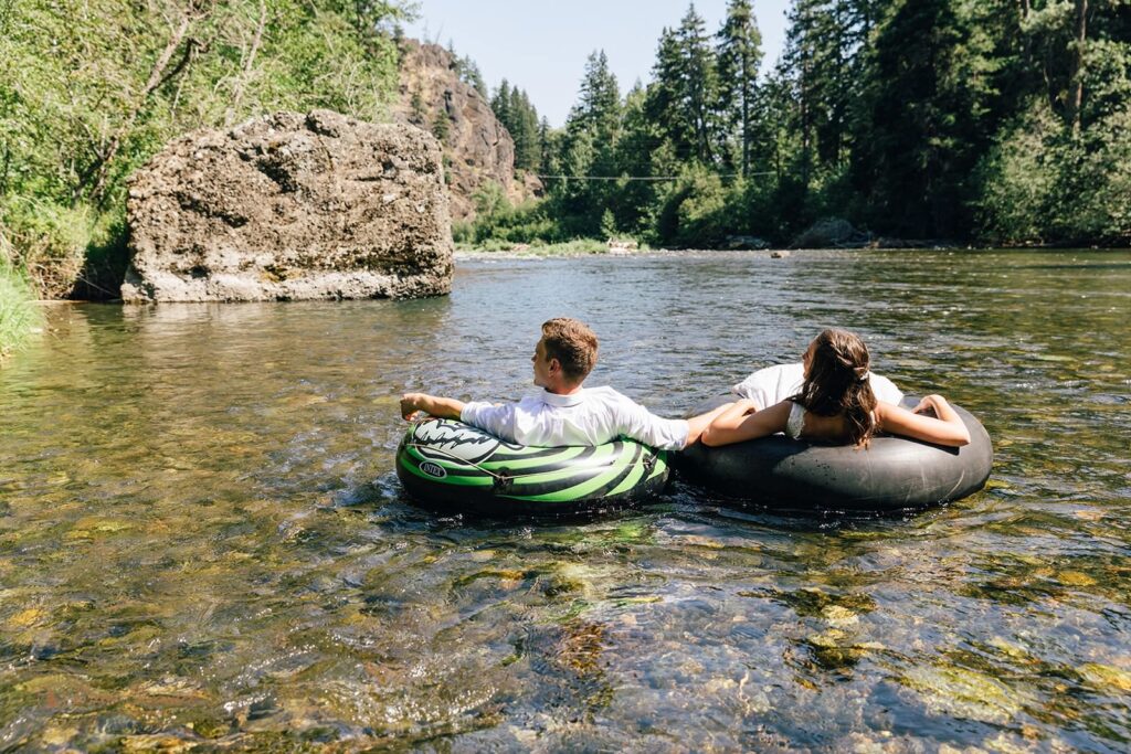 A couple floats down Naches River.