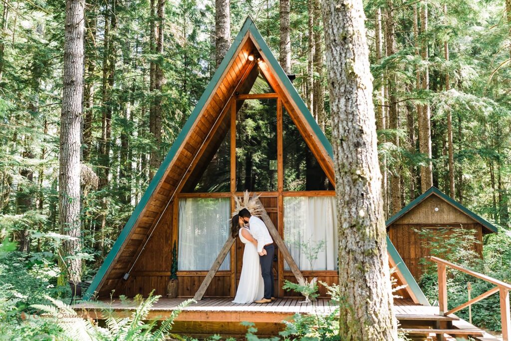 A couple celebrates their Washington State elopement at a pacific northwest cabin.
