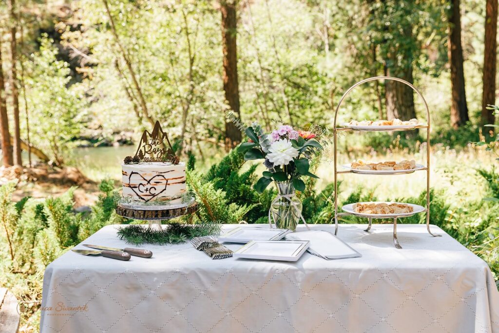 A dessert table at an intimate outdoor wedding.