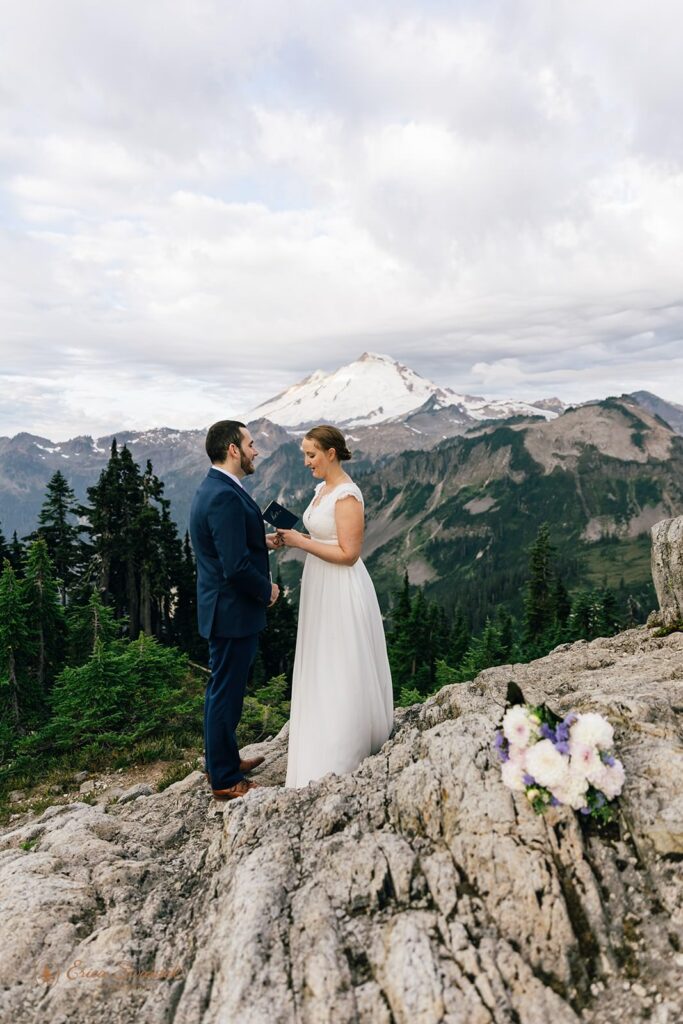 A woman reads vows to her soon-to-be husbands in Washington State on an overlook.