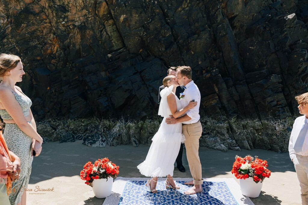 hug point elopement ceremony during a coastal elopement day in Oregon