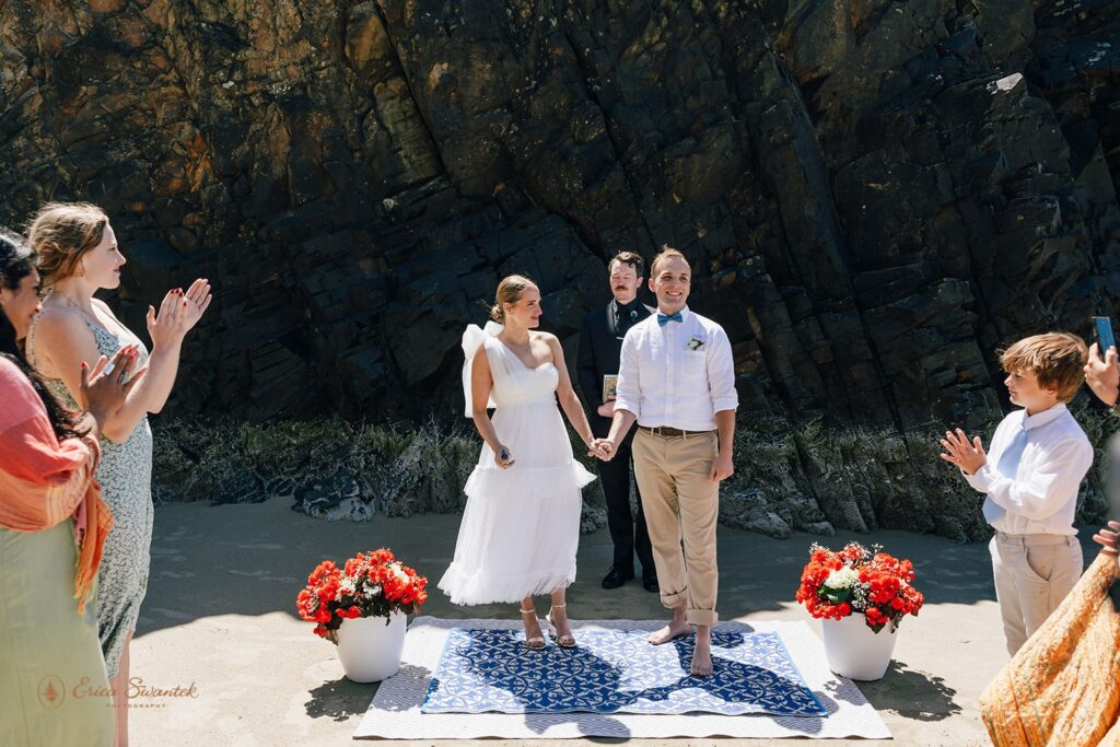 hug point elopement ceremony during a coastal elopement day in Oregon