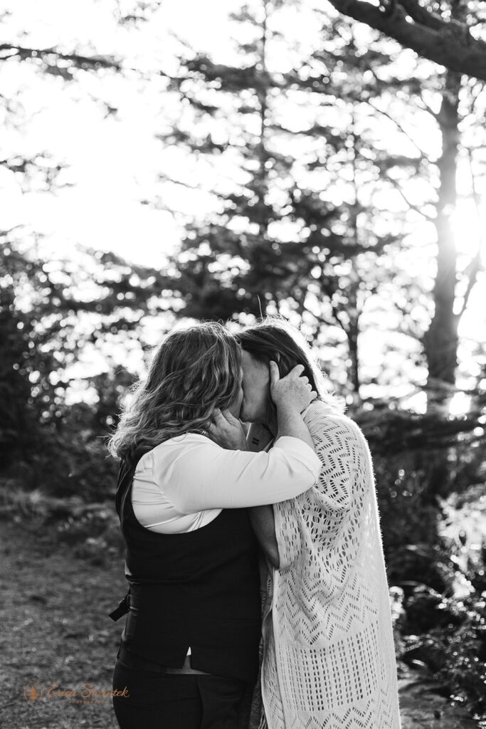 A couple kisses after saying I Do during their intimate Oregon elopement.