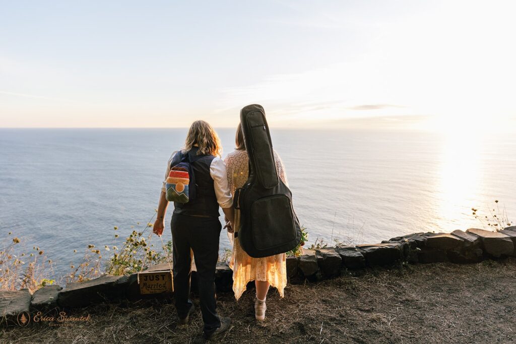 A elopement couple enjoys the view over Cape Perpetua in Oregon.