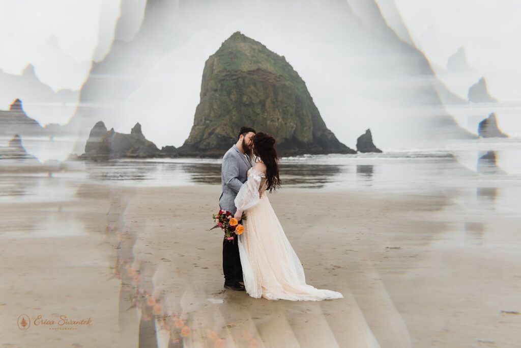 A couple kisses on Cannon Beach on an overcast day during their beach elopement.