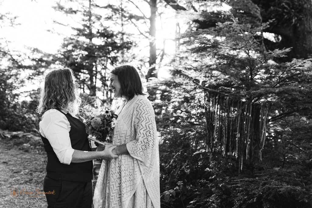 A beautiful couple shares vows during an private elopement ceremony in an Oregon coastal forest. 
