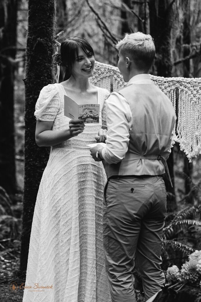 A couple recites intimate vows during their elopement ceremony along Drift Falls Trail in Siuslaw National Forest. 