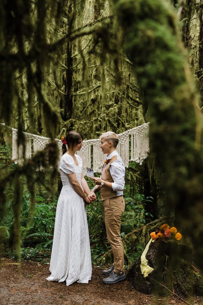 A couple celebrates their elopement at Drift Creek Falls Trailhead in Siuslaw National Forest with a boho ceremony in Oregon.