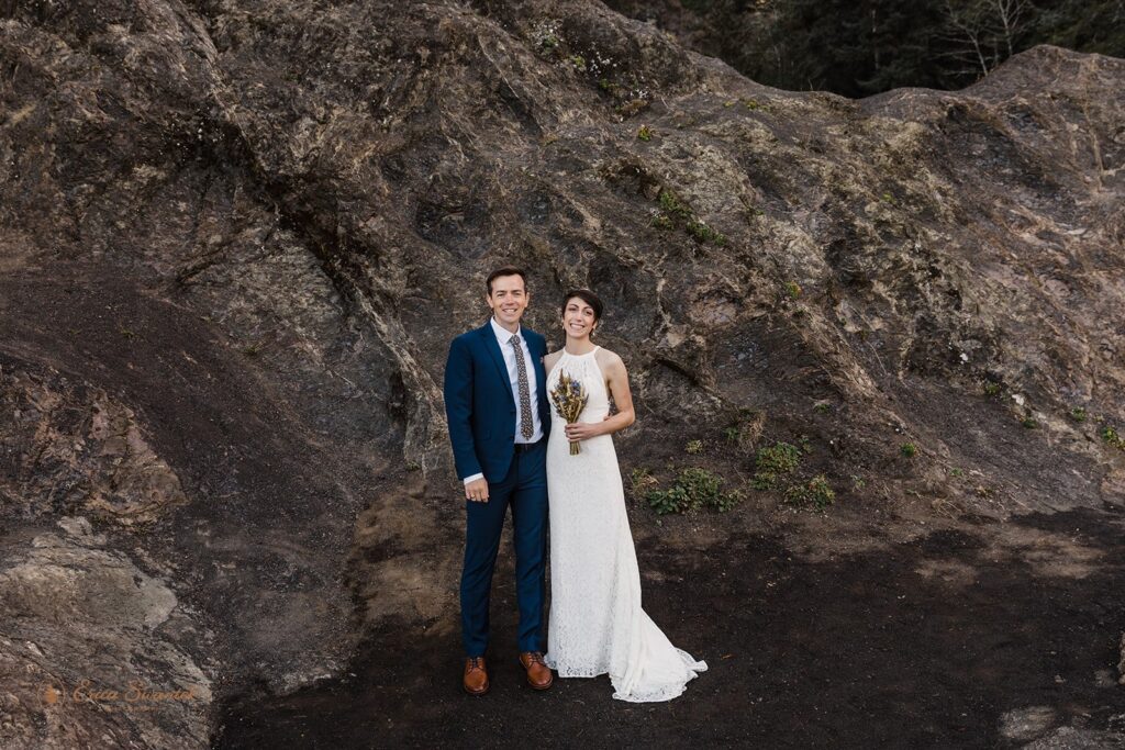 A couple poses for a classic wedding portrait in Samuel H. Boardman State Park in Oregon.