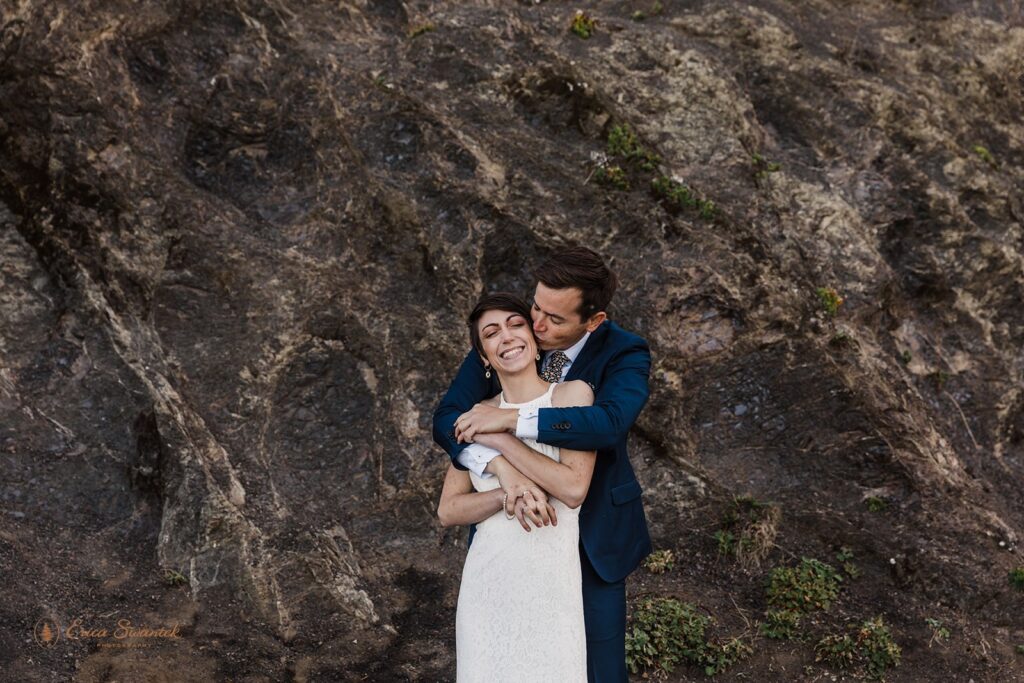 A couple embraces after their Samuel H. Boardman State Park elopement.