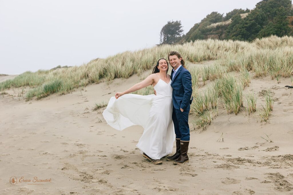 playful elopement couple at the beach in newport during their oregon coast elopement