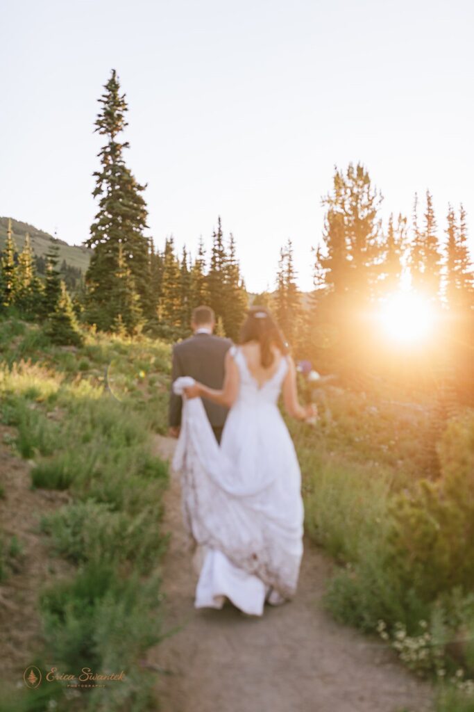 A bride and groom walk along a Sunrise Area hiking trail in Mt. Rainier National Park.