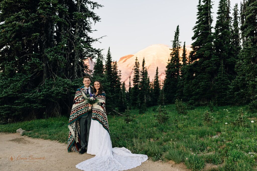 An couple poses for a National Park wedding portrait during their Mt. Rainier elopement in Sunrise Area. 