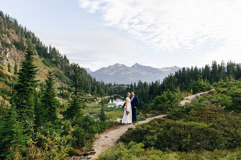 A couple poses for an outdoor wedding portrait during their Washington elopement at Reflection Lakes. 
