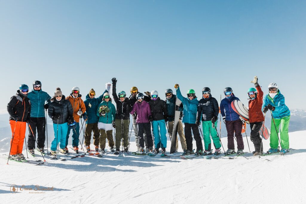 A wedding party cheers on the slopes at a ski ceremony at Mt. Bachelor. 