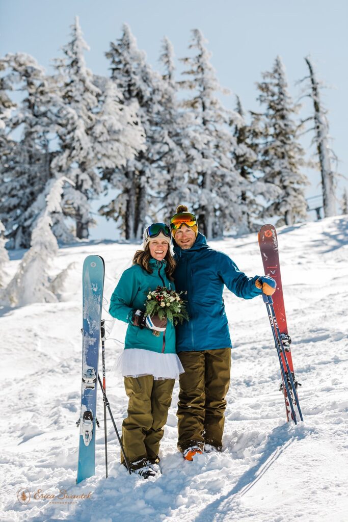 A ski elopement bride and groom pose for a portrait on a slope at Mt. Bachelor. 