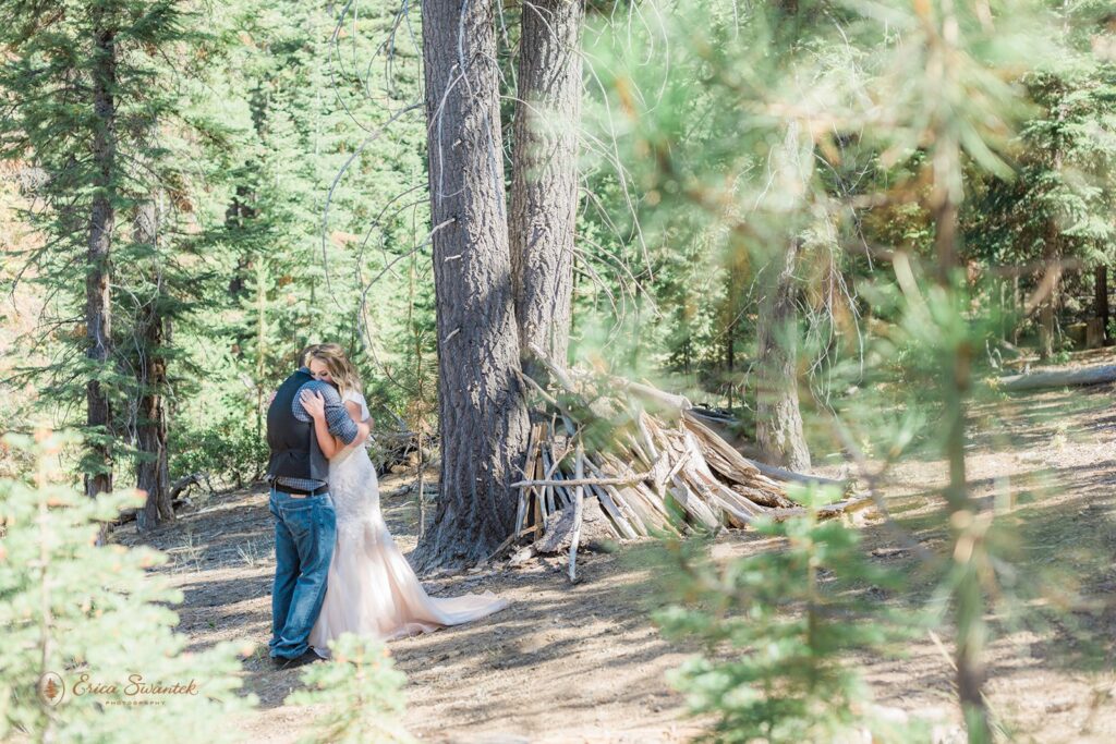 An Oregon intimate wedding couple embraces during their first look at Skyliner's Lodge near Bend, Oregon. 